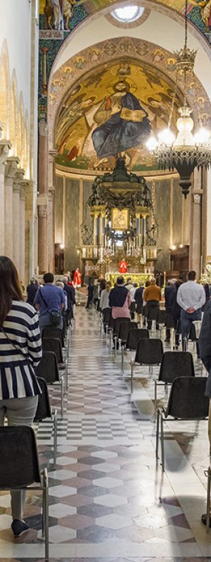 Sicily, Italy - May 31, 2020: Holy mass in Christian church during the coronavirus pandemic Covid-19.